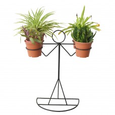Balancing man shaped metal plant stand